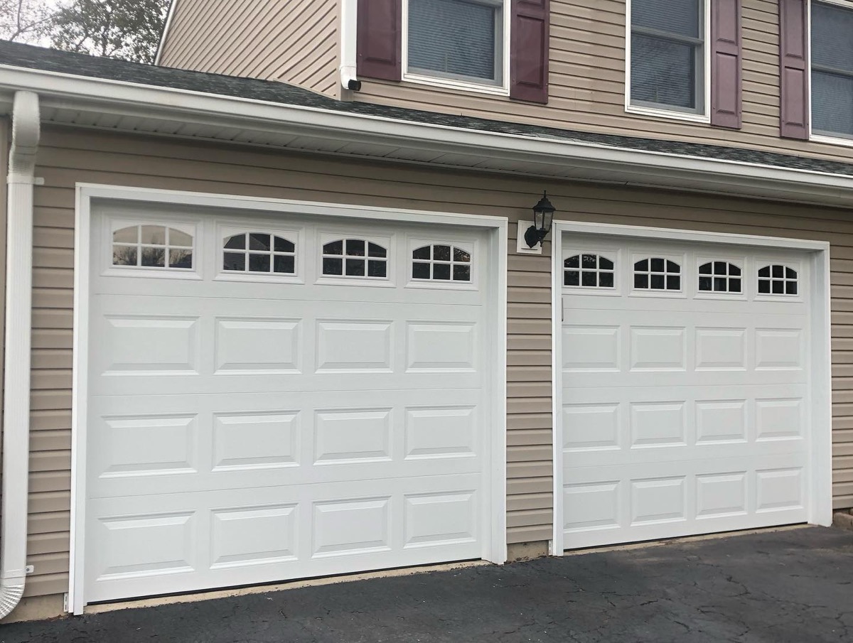 Custom garage door design with designer hardware, installed by Prolift